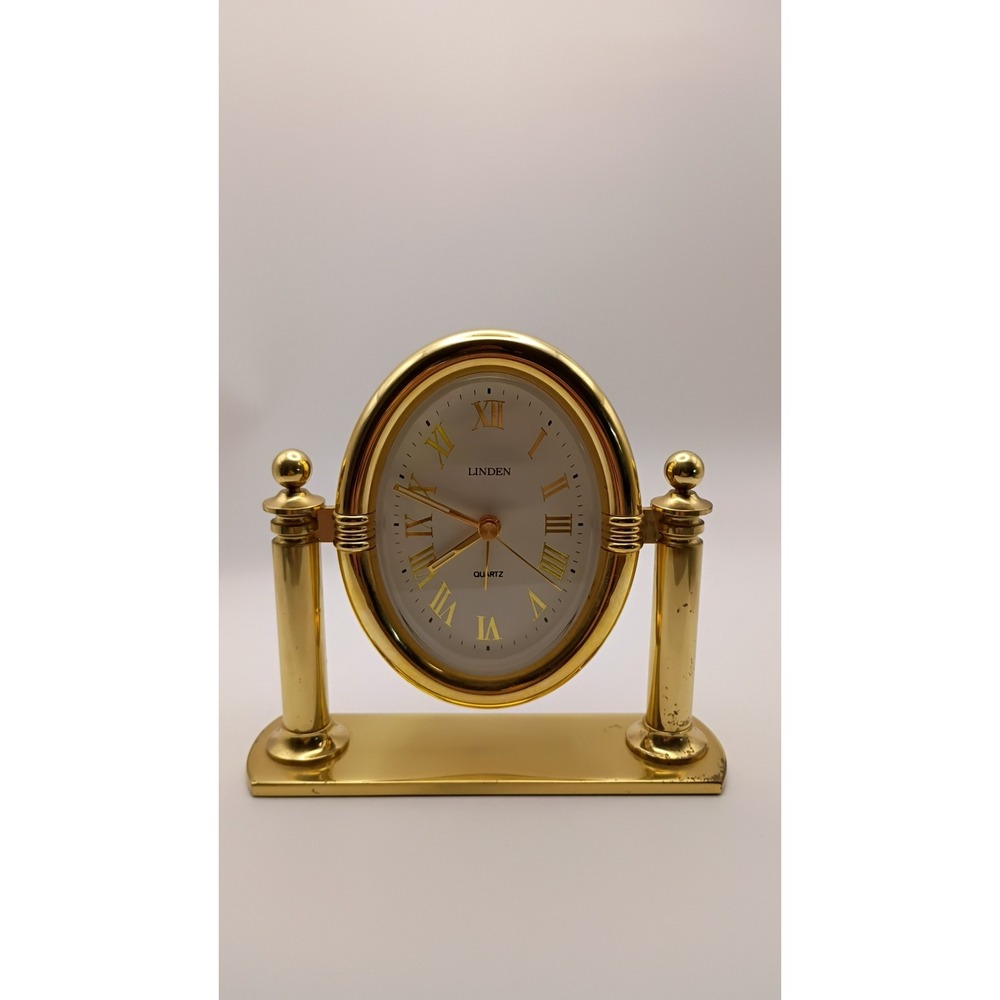 Linden Quartz Oval Desk Clock Gold Tone Swivel Pillar Mantle Timepiece